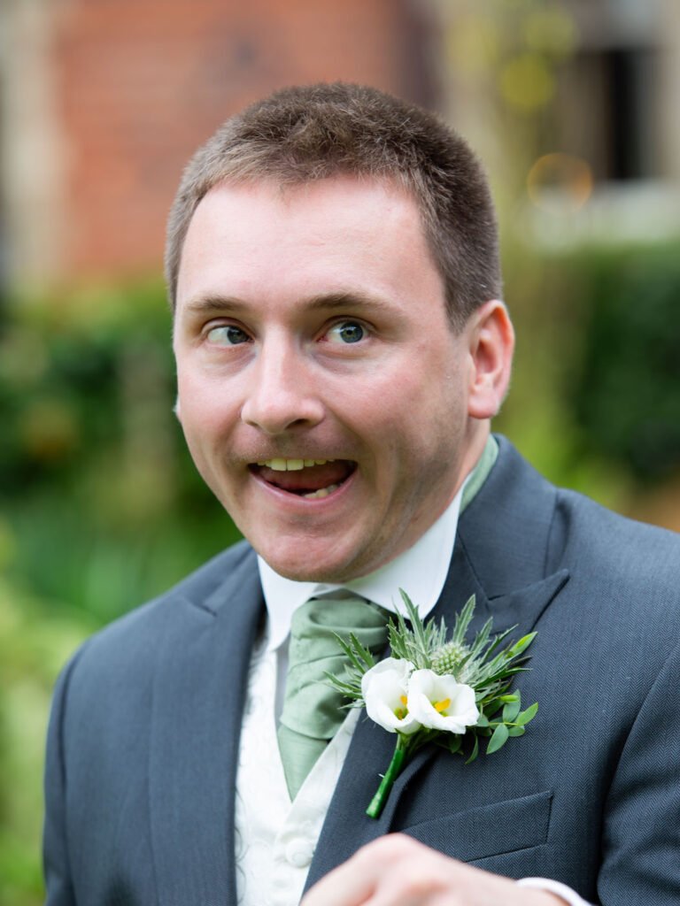 Wedding Photographer at Brownsover Hall Hotel in Rugby groomsman silly portrait