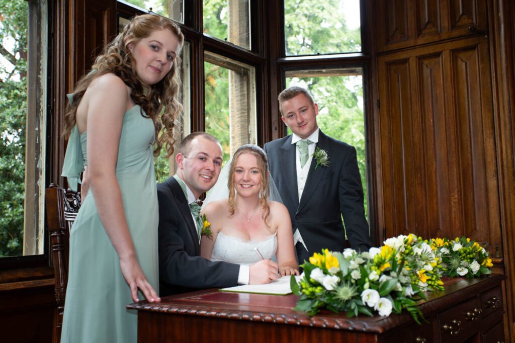 Wedding Photographer at Brownsover Hall Hotel in Rugby signing of the registrar