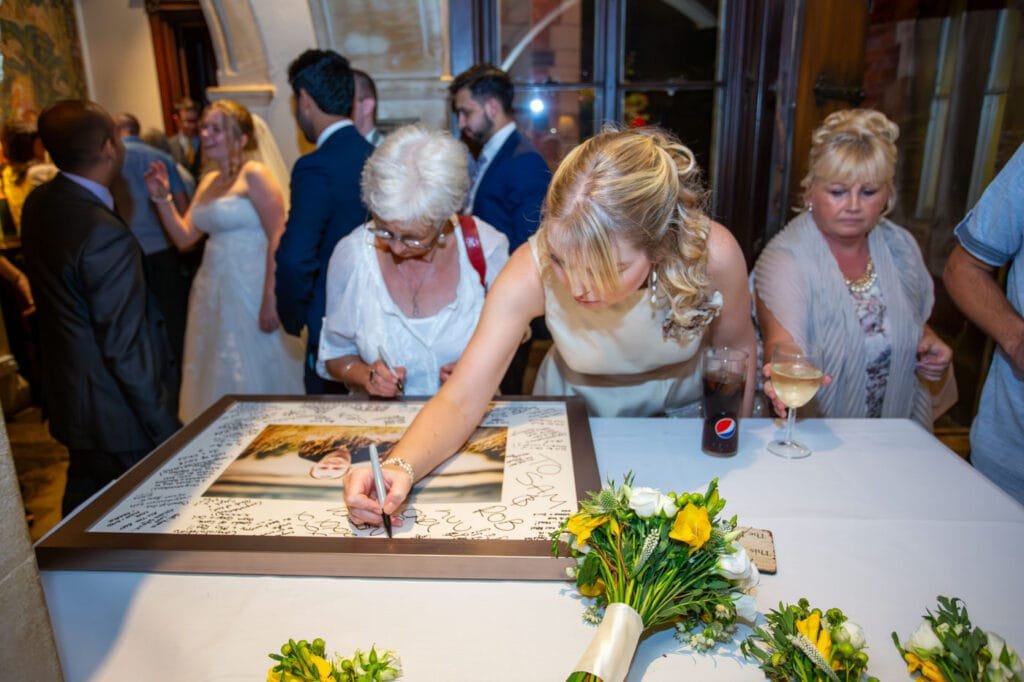 Wedding Photographer at Brownsover Hall Hotel in Rugby signing board