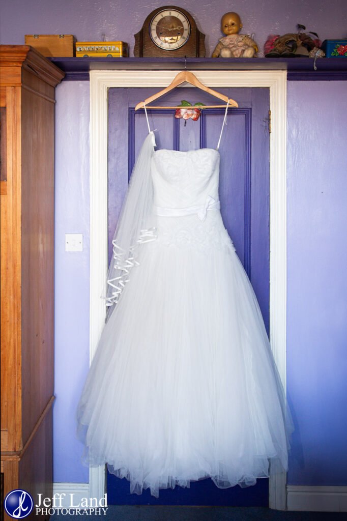 Bridal prep wedding dress hanging