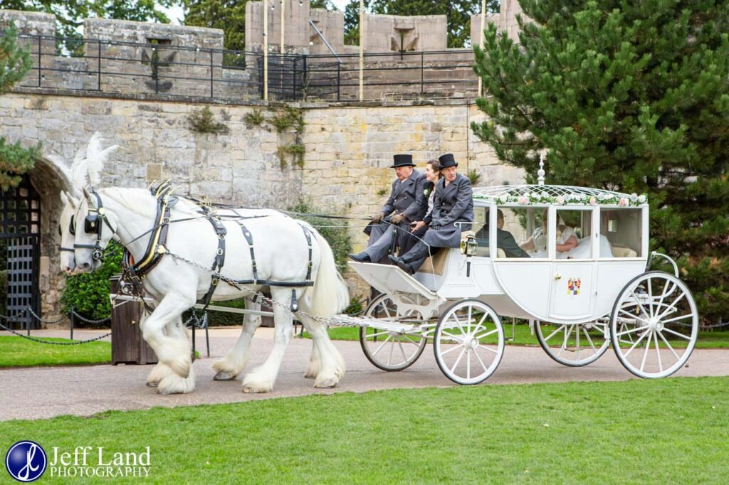 Bride and Groom in Horse Drawn Carriage at a Wedding in Warwick Castle