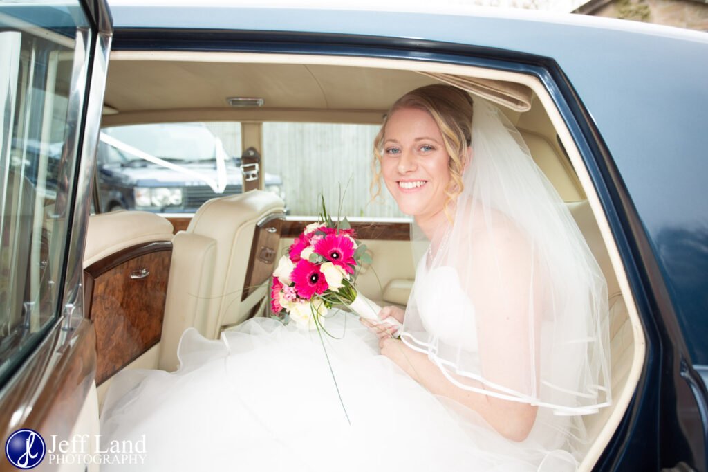 Bride in Rolls Royce Wedding Car