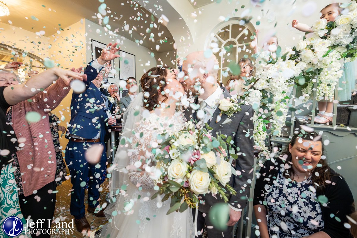 Bride and Groom Confetti Kiss Photo Warwick House