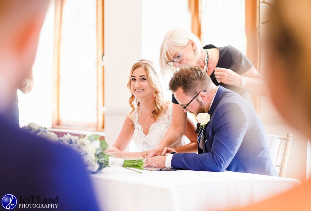 Approved Wedding Photographer Macdonald Alveston Manor Stratford-upon-Avon, Warwickshire Sign The Registar