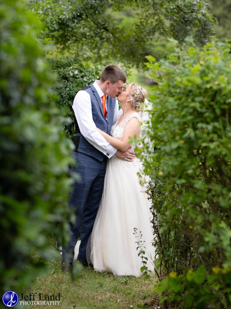 Romantic Bridal portrait kissing at the Vale Golf Club Evesham
