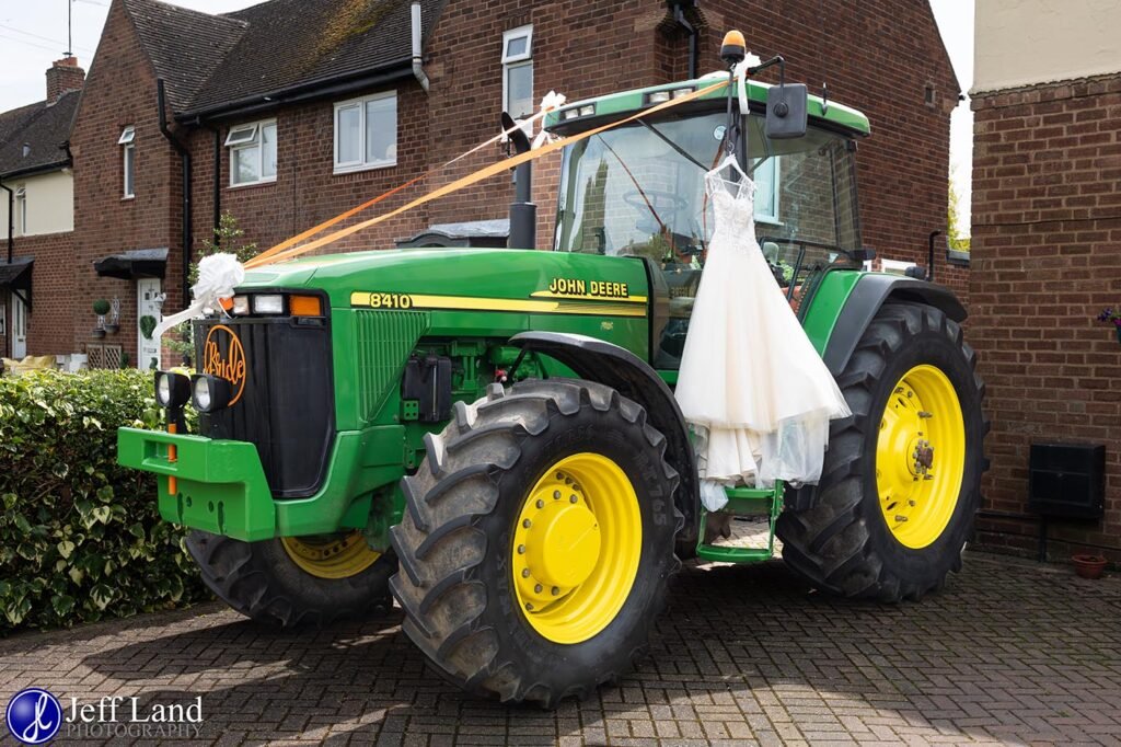 Wedding dress hanging on the father of the brides John Deere Tractor