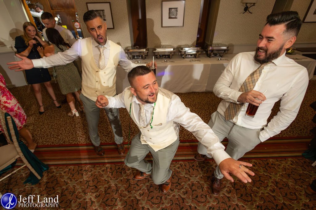 Candid Groomsmen having fun on the dance floor approved Wedding Photographer Alveston Manor Stratford upon Avon