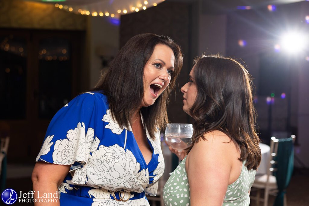 Candid Guests chatting on dance floor approved Wedding Photographer Alveston Manor Stratford upon Avon