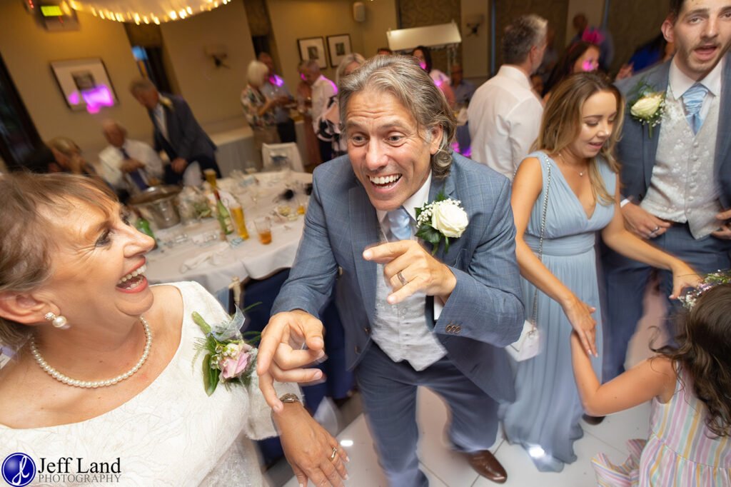 Celebraty Guest having fun on the dance floor during the wedding celebrations at Alveston Manor