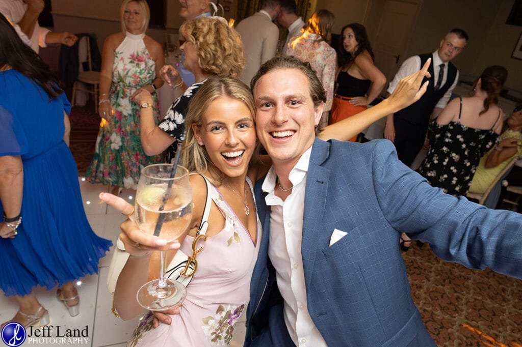 Guests having fun on the dance floor during the wedding celebrations at Alveston Manor