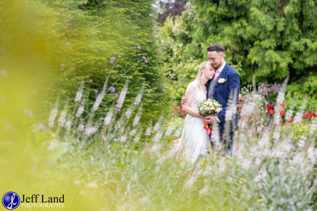 Wedding Reception at Alveston Pastures Farm Stratford upon Avon, Warwickshire romantic bride and groom portrait in the flower garden