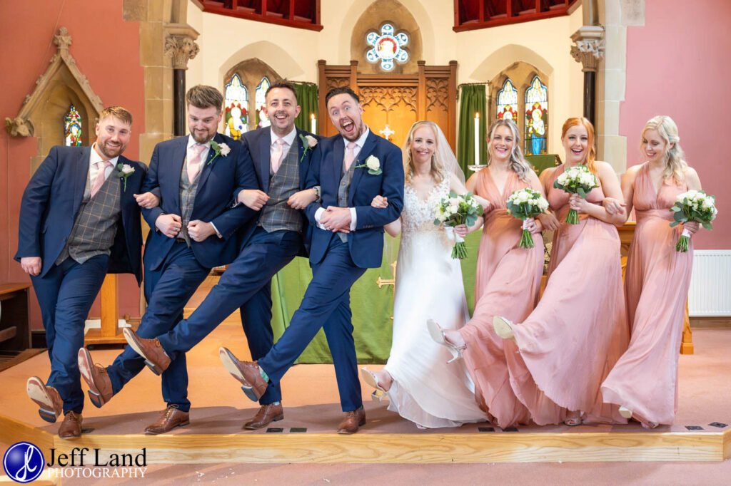 Wedding St Andrews Church Stratford upon Avon, Warwickshire fun bridal party group portrait