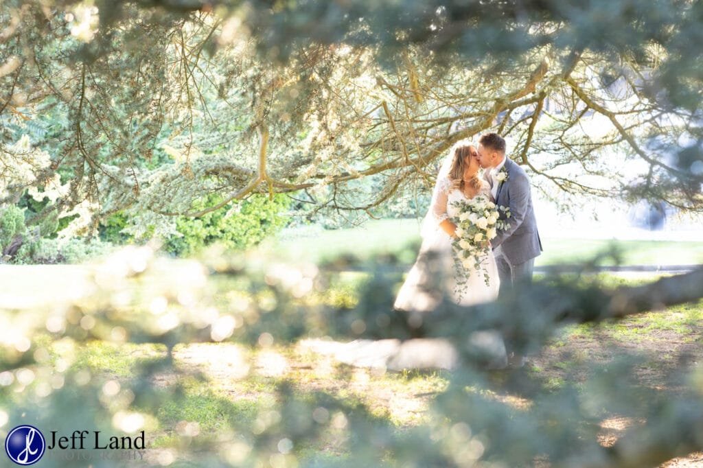 Bride & Groom Romantic Kiss Bridal Portrait under Cedar Tree Alveston Manor