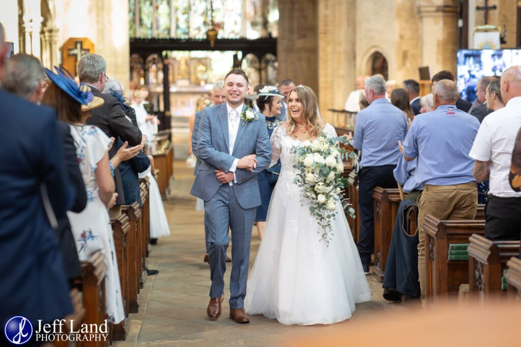 Bride and Groom Just Married walking down the aisle Holy Trinity Church Stratford upon Avon