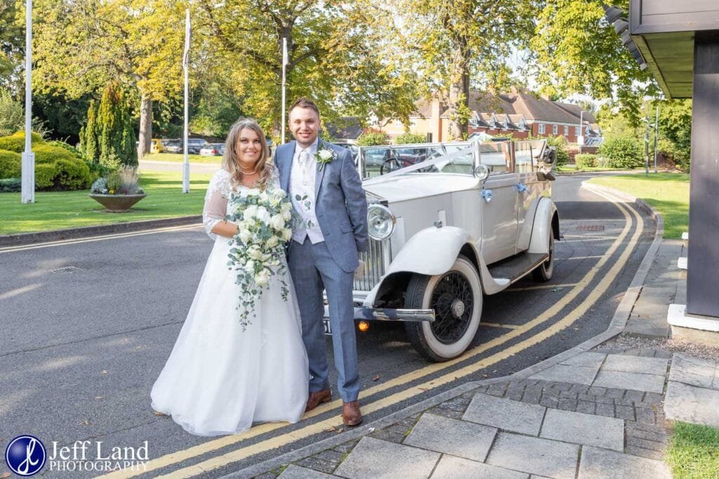 Bride and Groom With White Rolls Royce Wedding Car Alveston Manor Stratford upon Avon