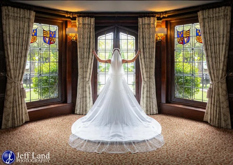 Bride posing in bay window Alveston Manor