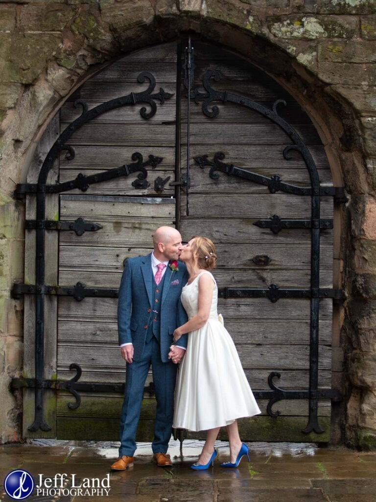 Bride and Groom wedding portrait by main gate at the Lord Leycester Hospital in Warwick