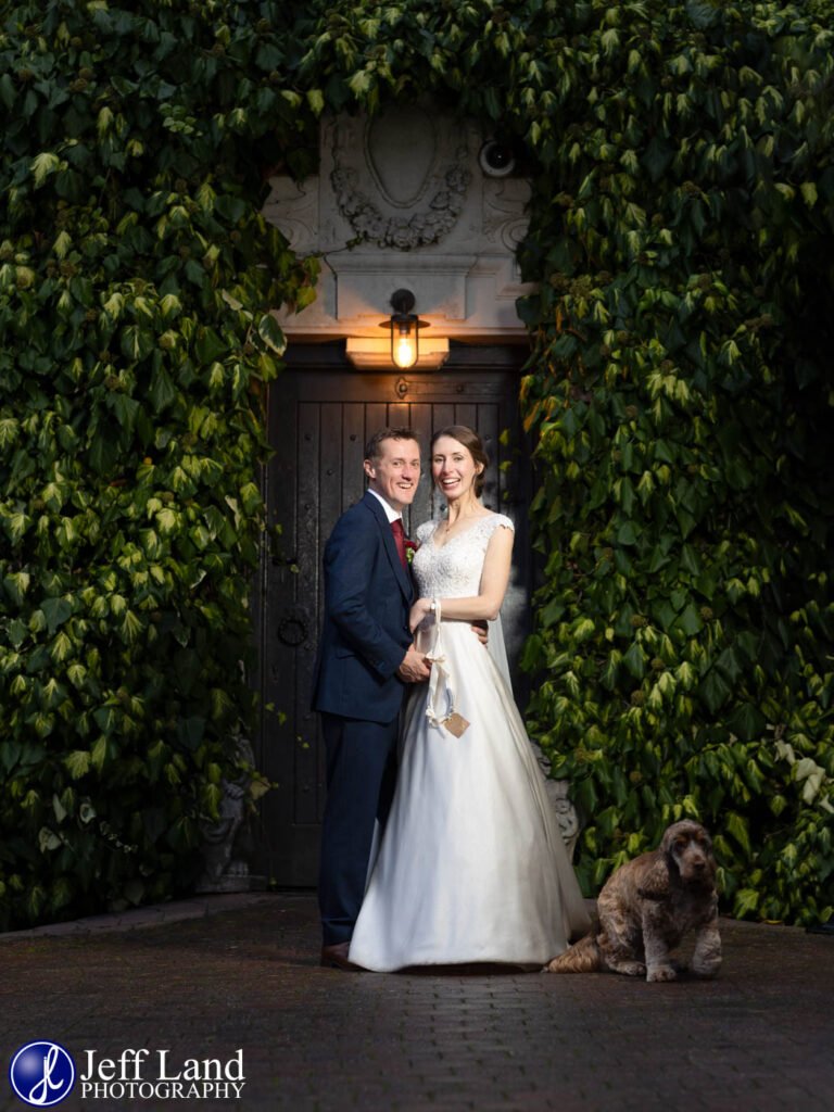 Happy Bride and Groom portrait with Dog at Nuthurst Grange