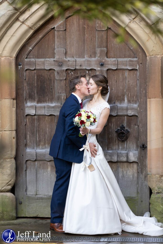 Happy Bride anmd Groom Kiss at Knowle Parish Church