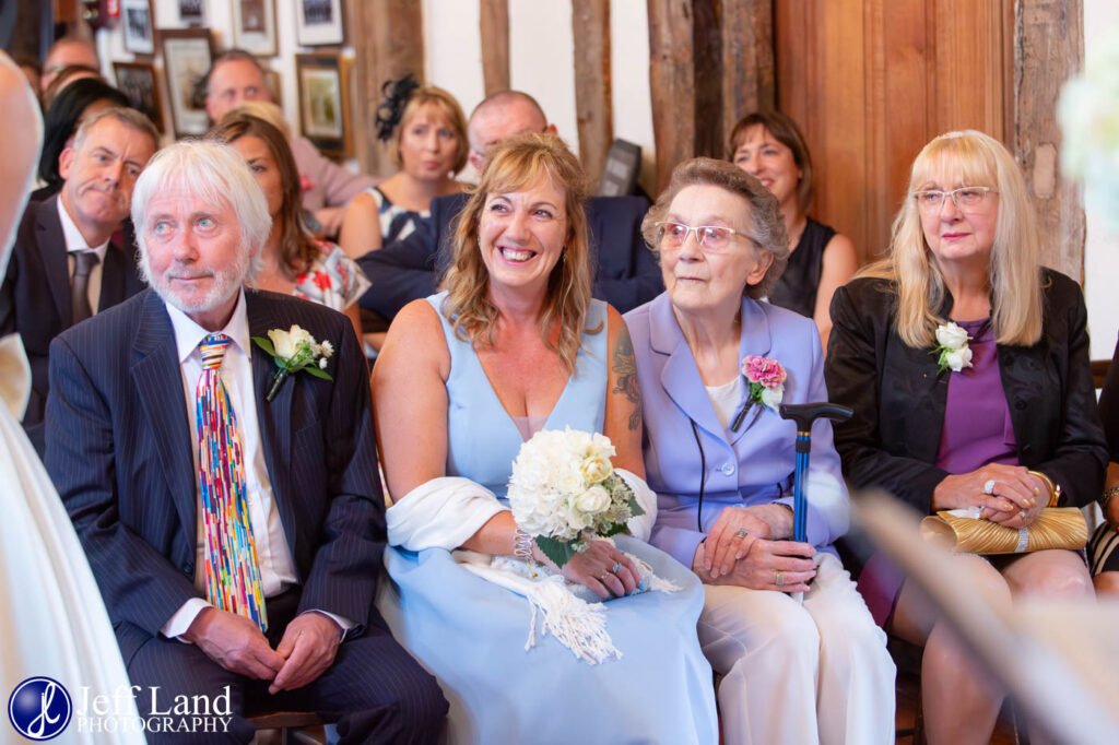 Happy guests photo during wedding ceremony at the Lord Leycester Hospital in Warwick