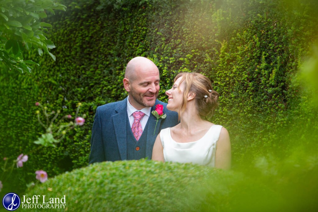 Romantic Bride and Groom wedding portrait in rear gardens at the Lord Leycester Hospital in Warwick