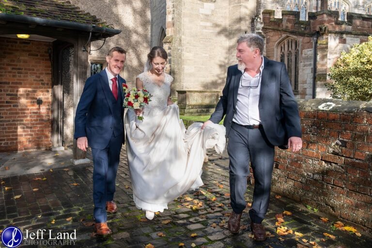 Jeff Land Local Wedding Photographer in Stratford-upon-Avon Warwickshire helping newlyweds