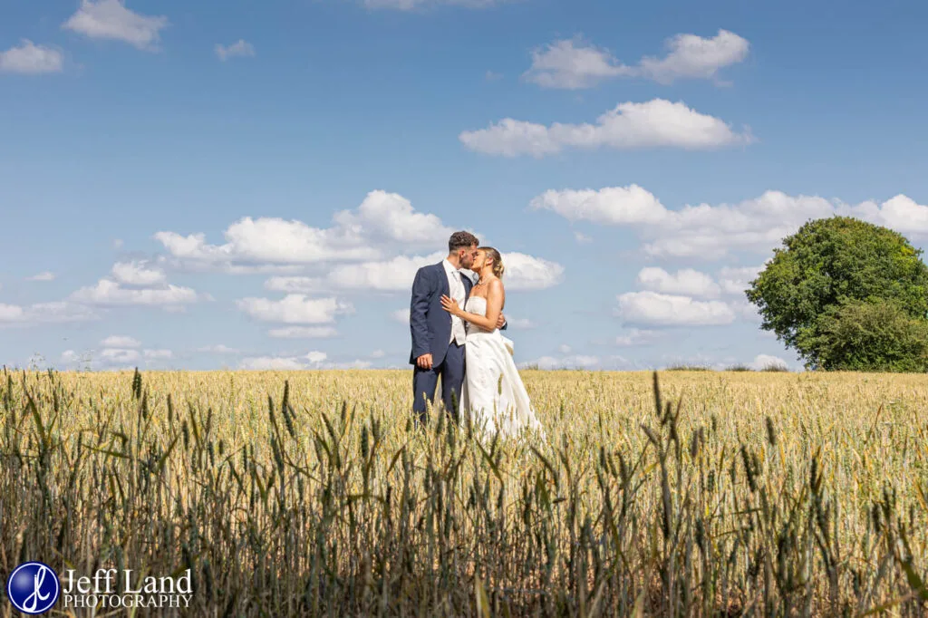 Manor Hill House Bride and Groom Kissing in Corn Field