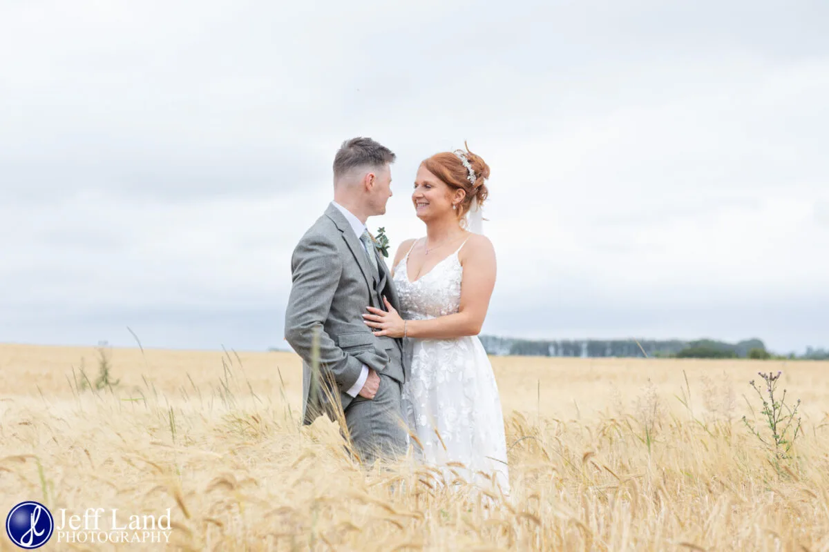 Bride and Groom in Corn Field Mickleton Hills Farm Wedding Venue