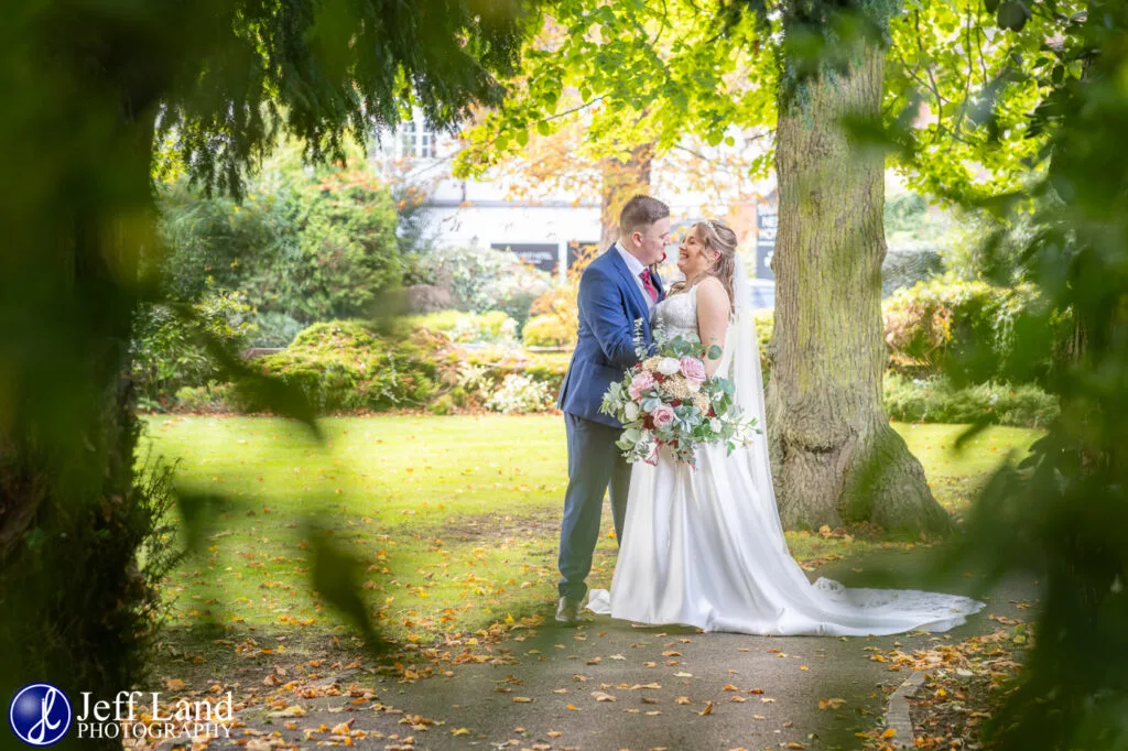 Fun bridal portrait in front gardens at Alveston Manor wedding