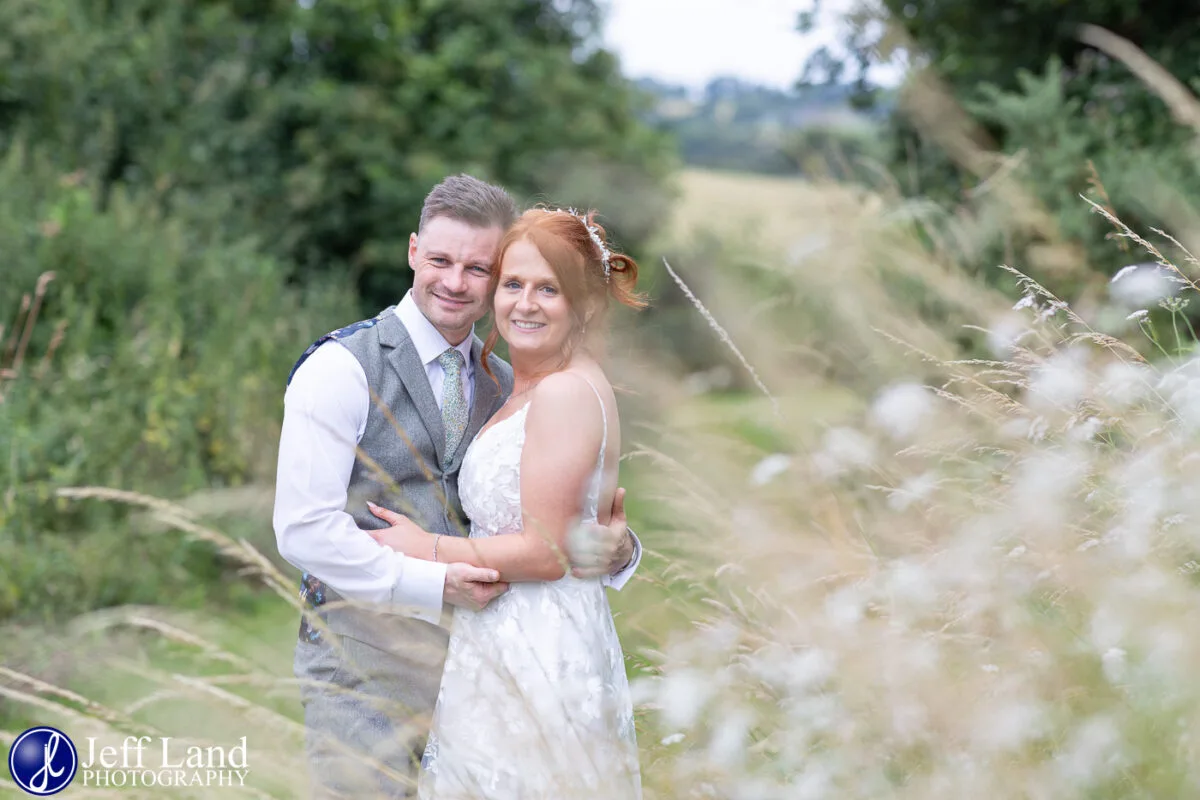 Mickleton Hills Farm Wedding Photography bride and groom portrait in long grass