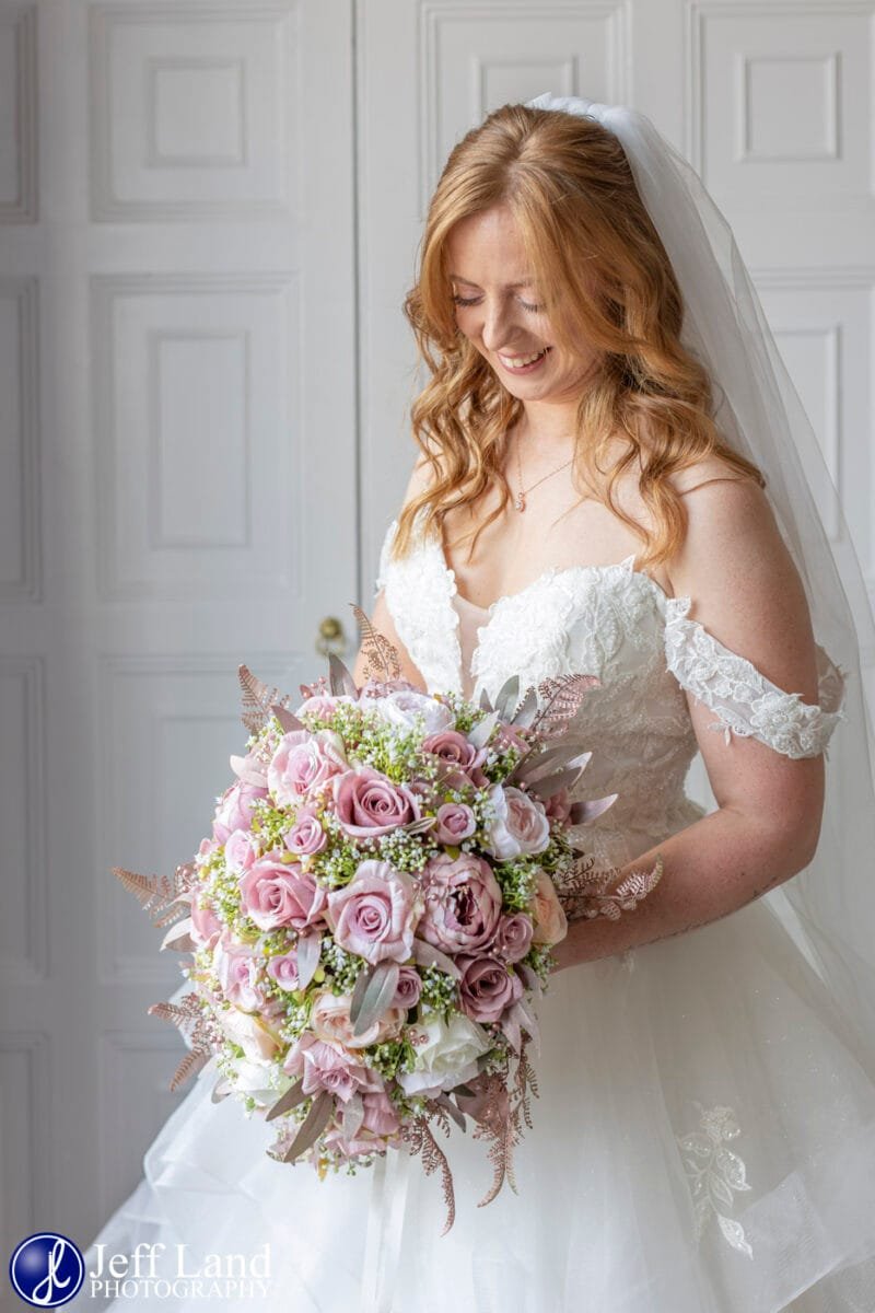 Happy Bride Portrait looking down at Alveston Manor Stratford-upon-Avon, Warwickshire