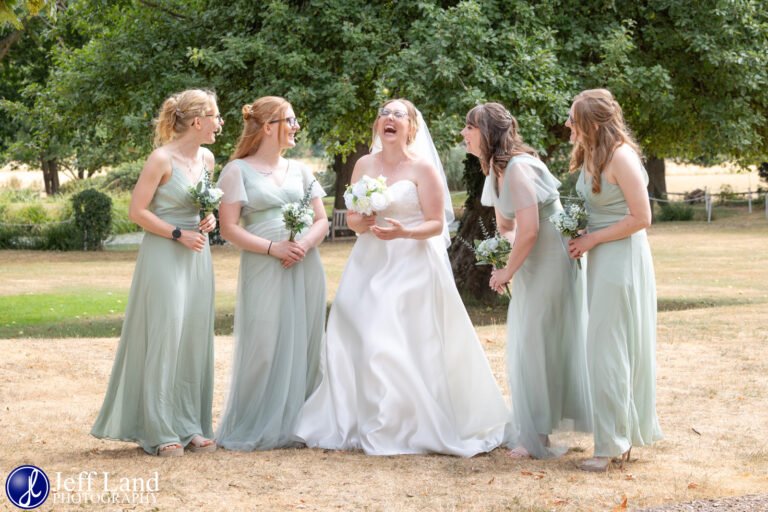 Bride Laughing with bridesmaids Nailcote Hall Wedding